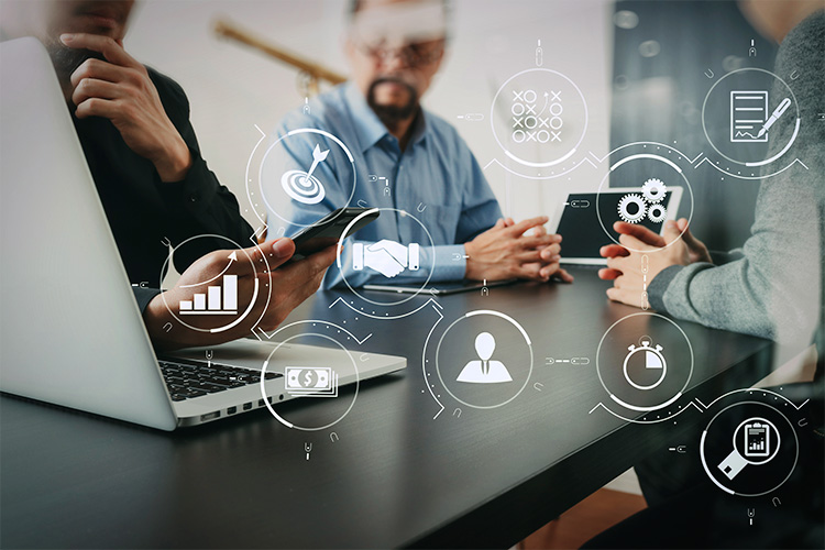 An illustrative image of SONIFI technical experts talking with hotel staff about managed services, with an overlay of icons representing SONIFI's professional services